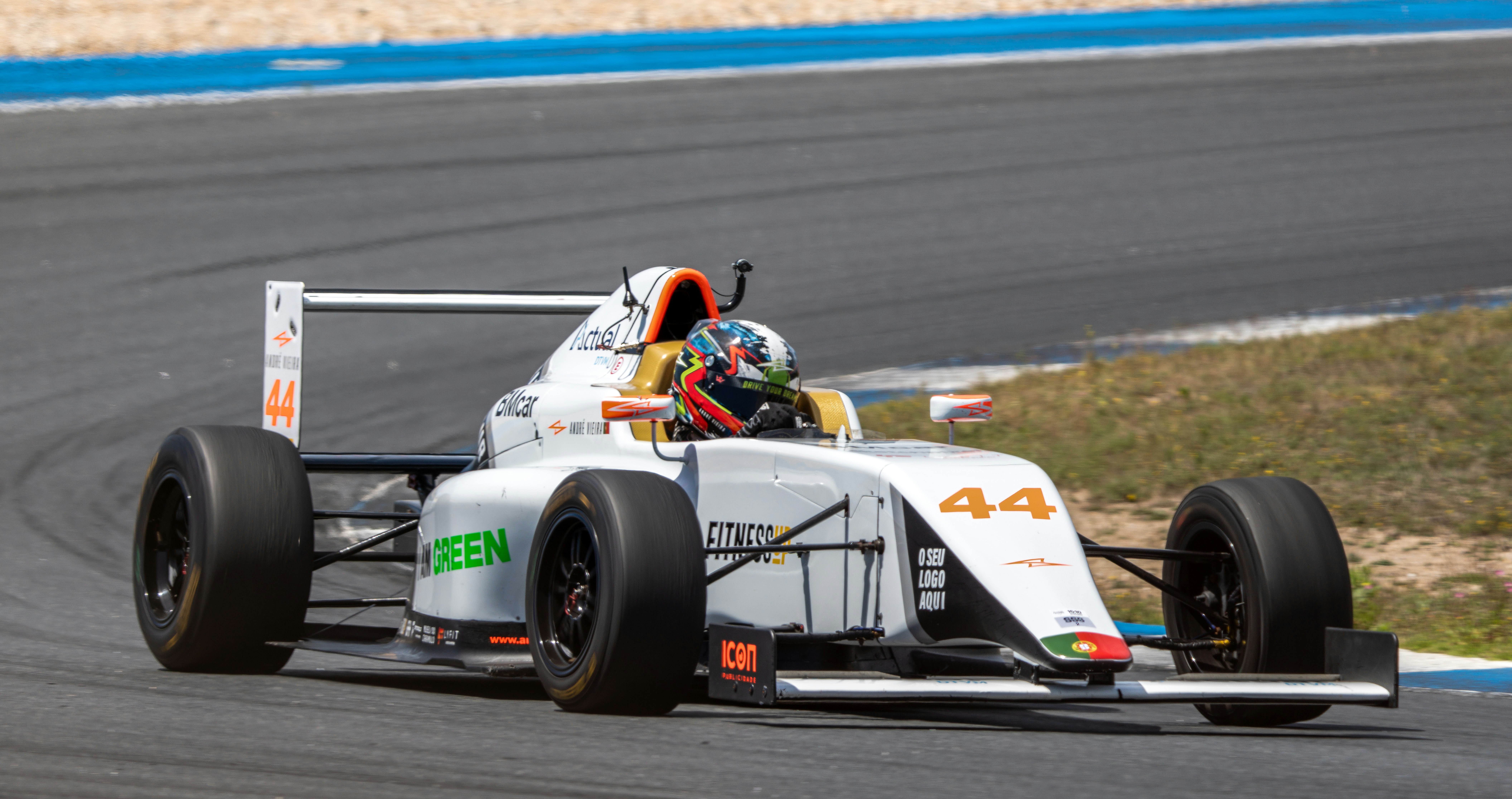 A man driving a race car on a track