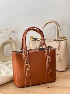 A couple of bags sitting on top of a wooden table