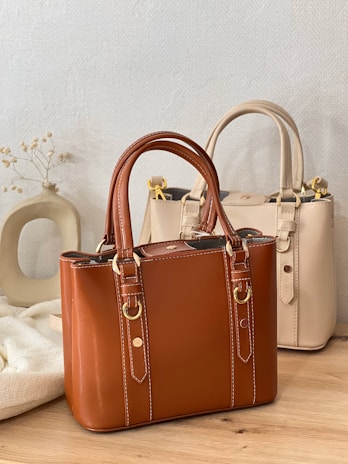 A couple of bags sitting on top of a wooden table