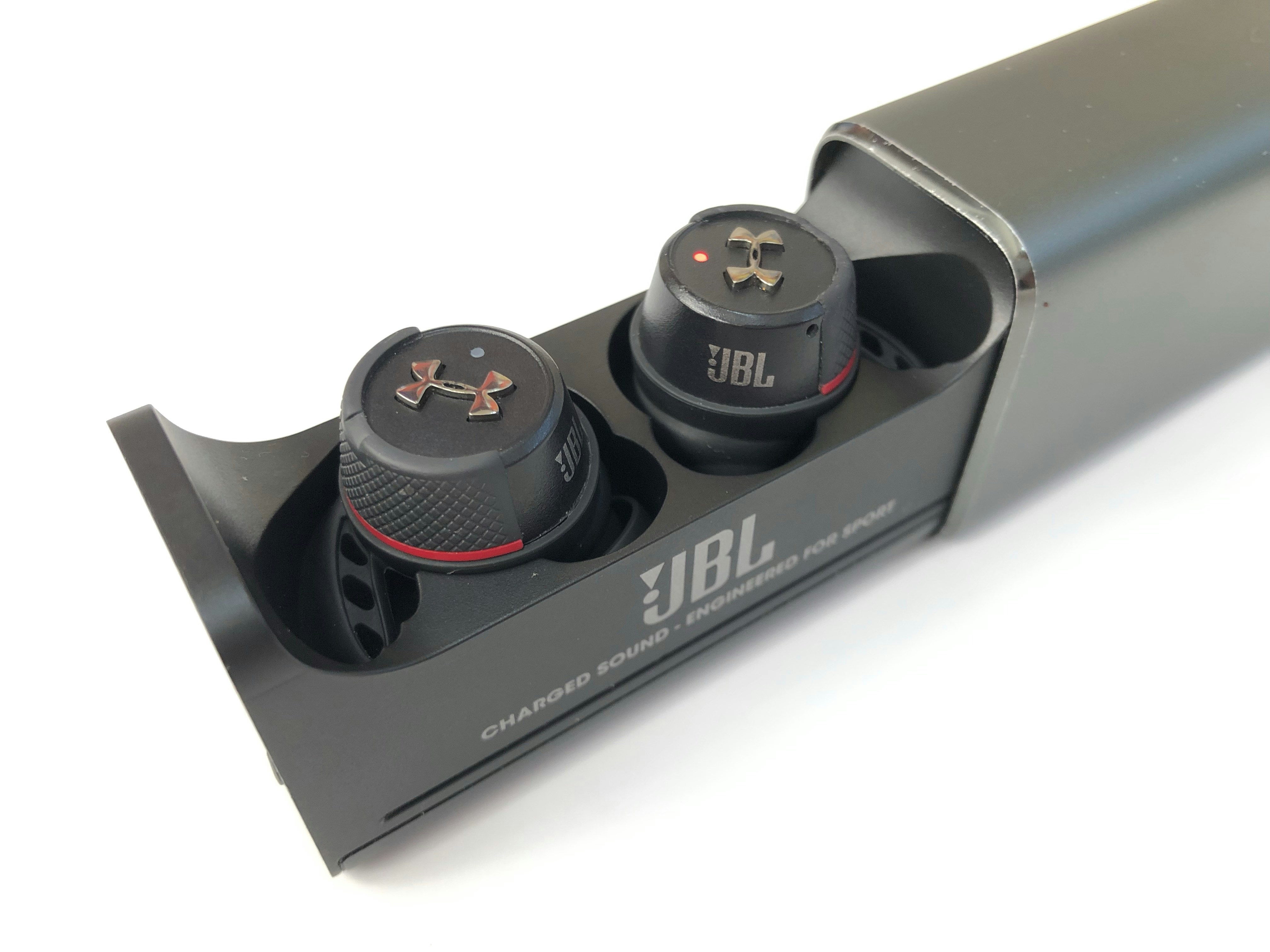 A couple of black knobs sitting inside of a black box