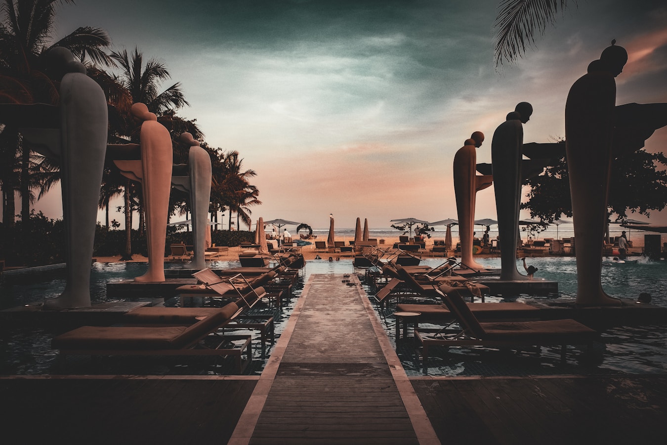 A group of people standing next to each other near a pool