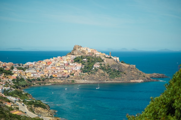 A view of a small town on a hill overlooking a body of water