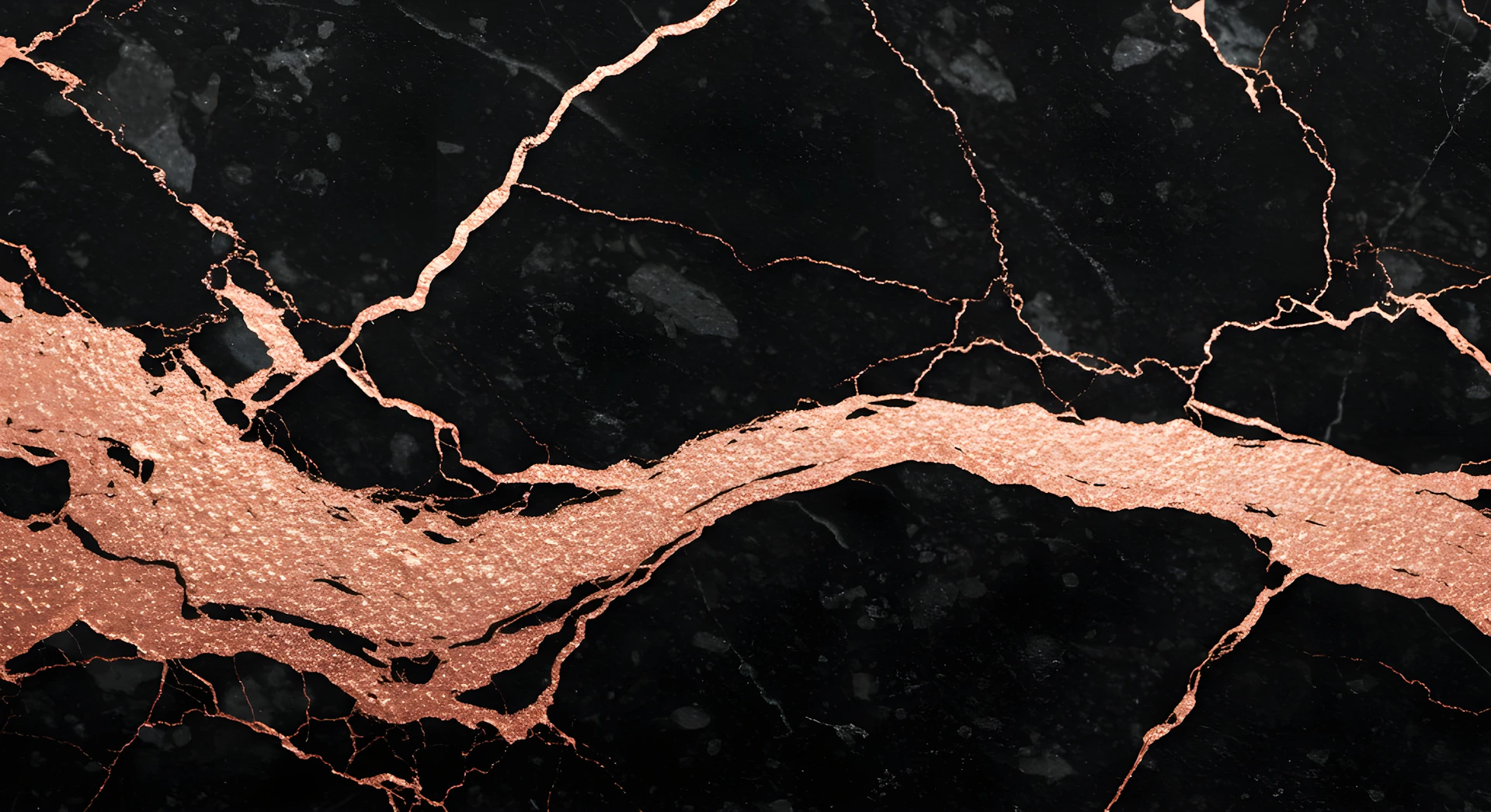A close up of a black and gold marble texture