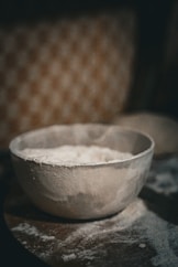 A white bowl sitting on top of a table