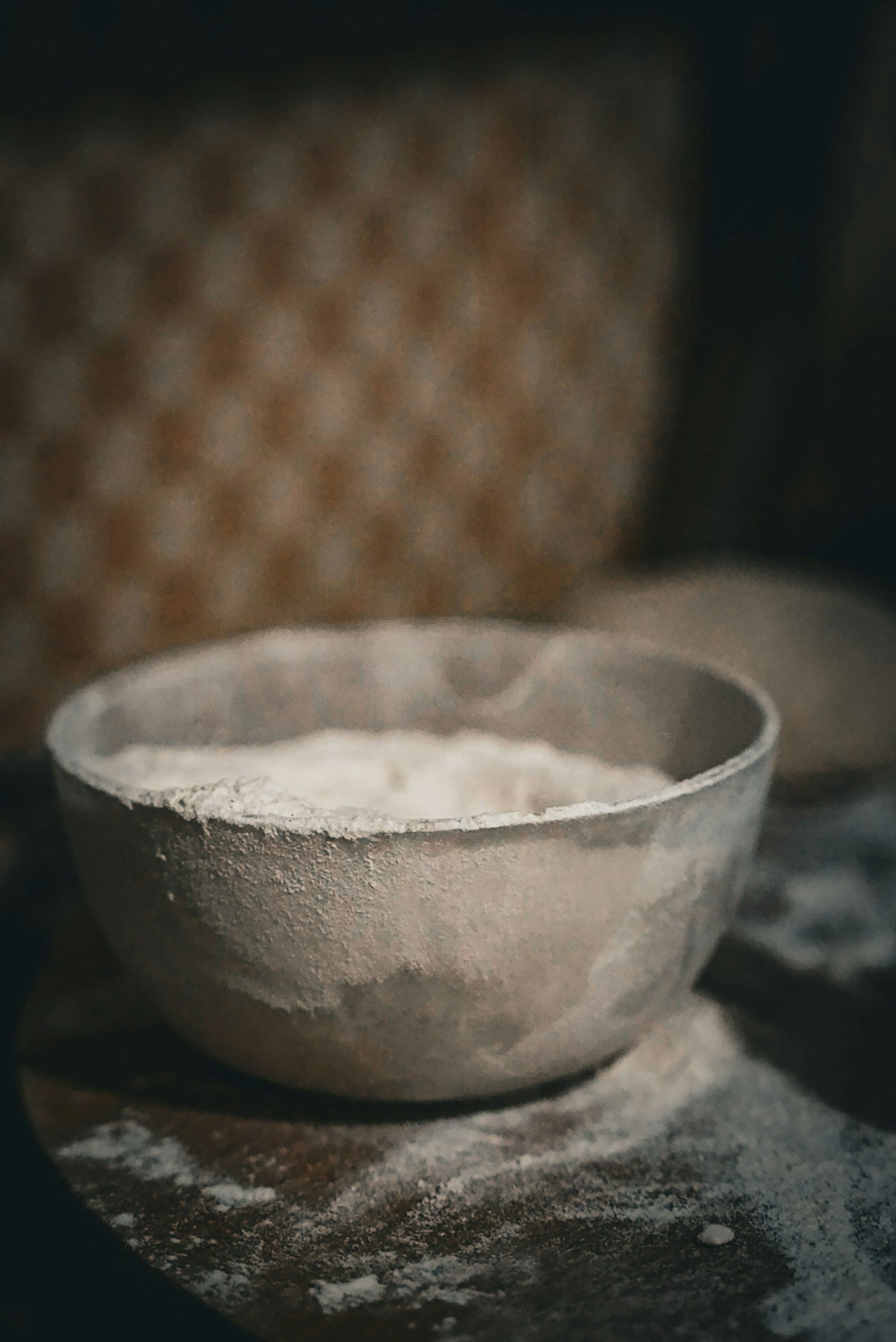 A white bowl sitting on top of a table