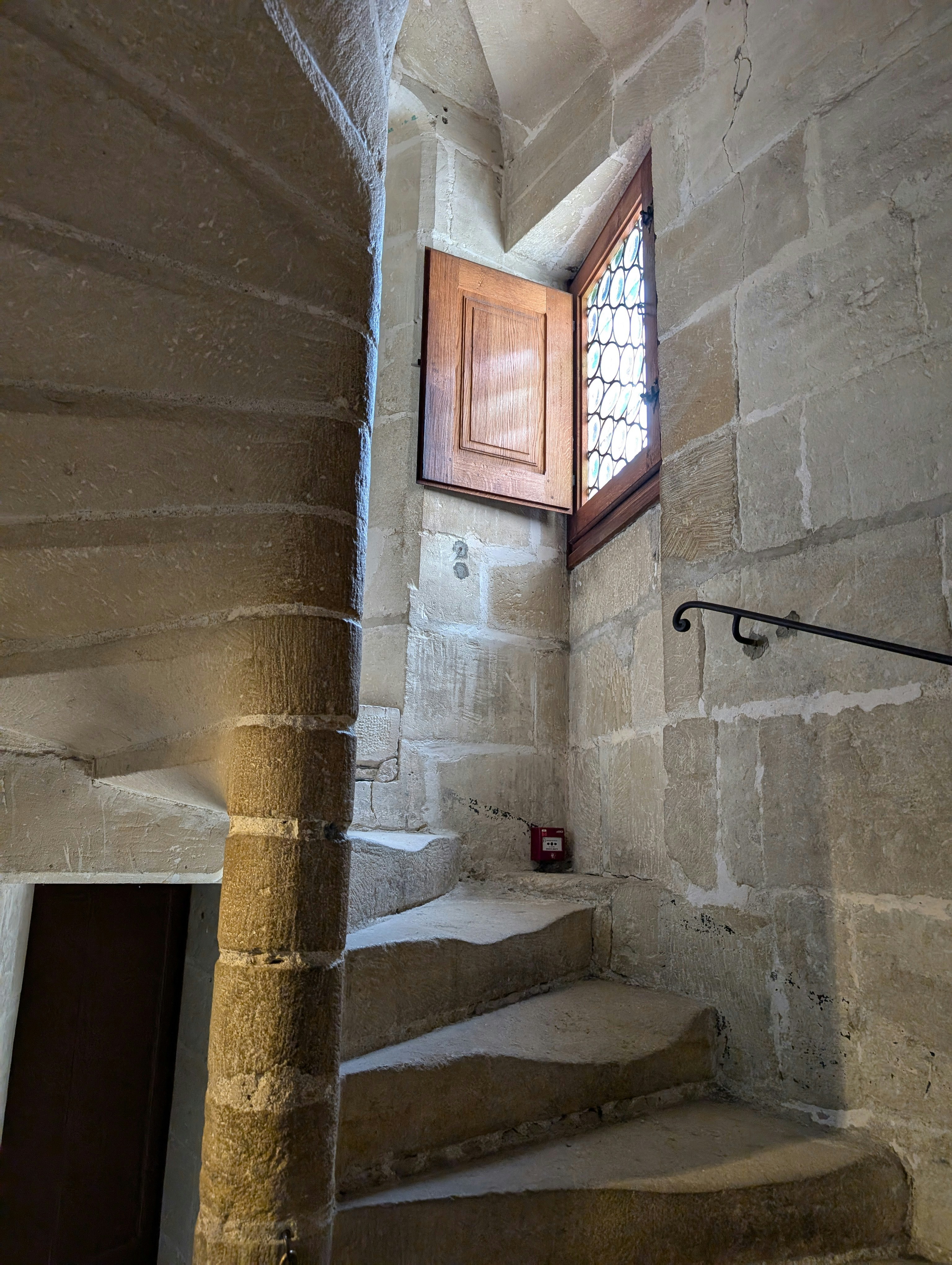 A set of stairs leading up to a window