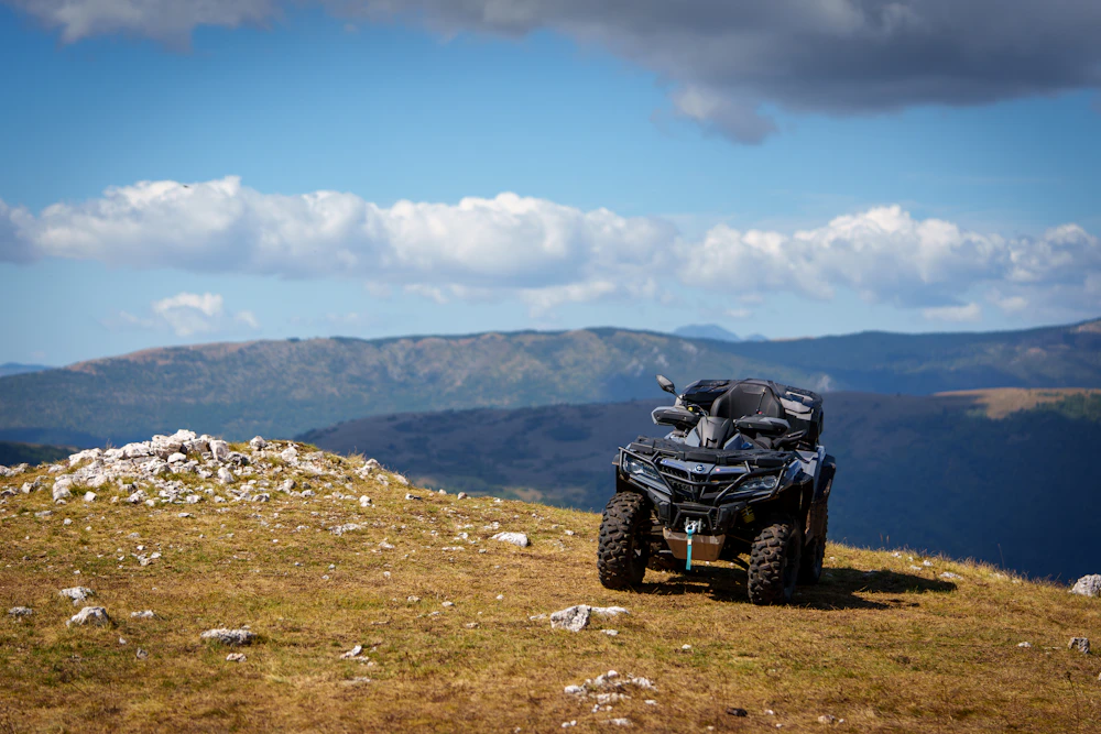 ATV parked outdoors on rugged land