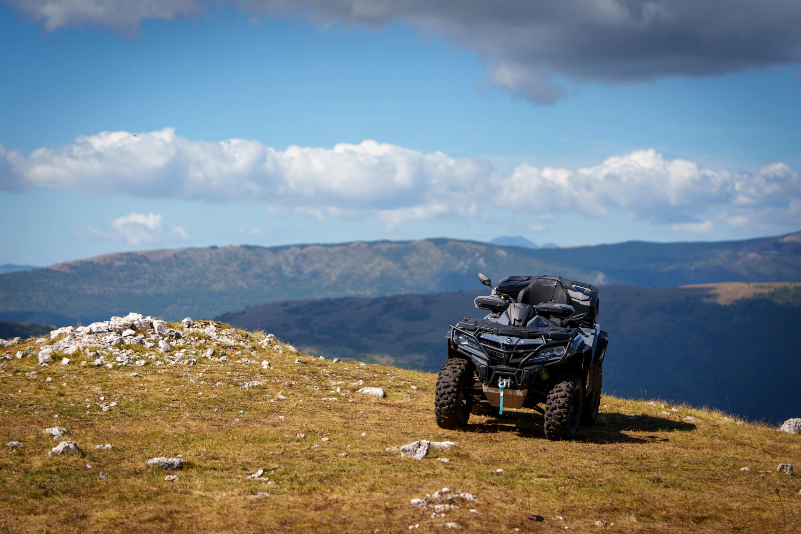 ATV parked on rugged mountain terrain