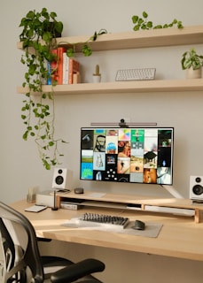 A desk with a computer monitor and keyboard