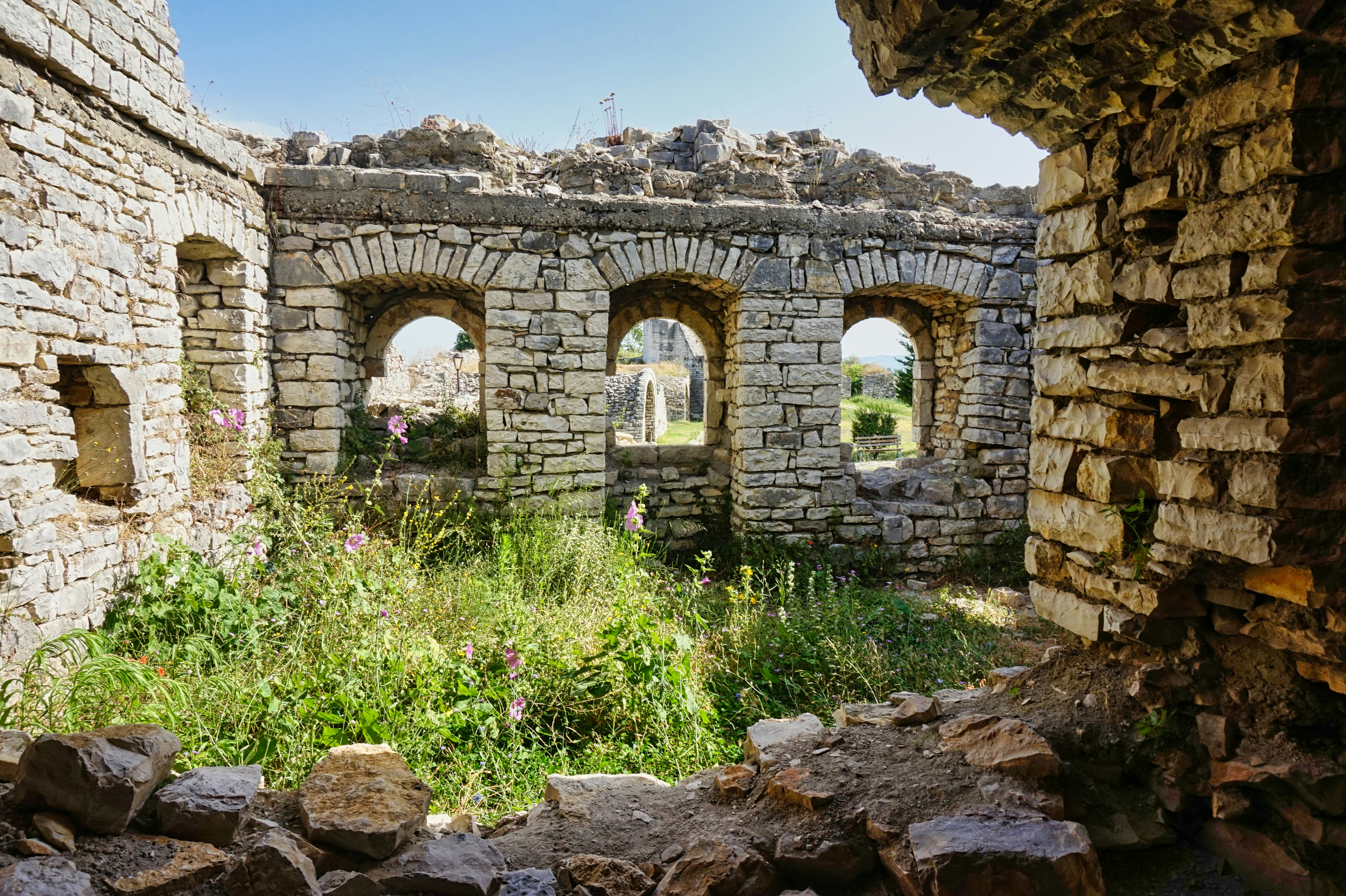A view of a stone building through a window