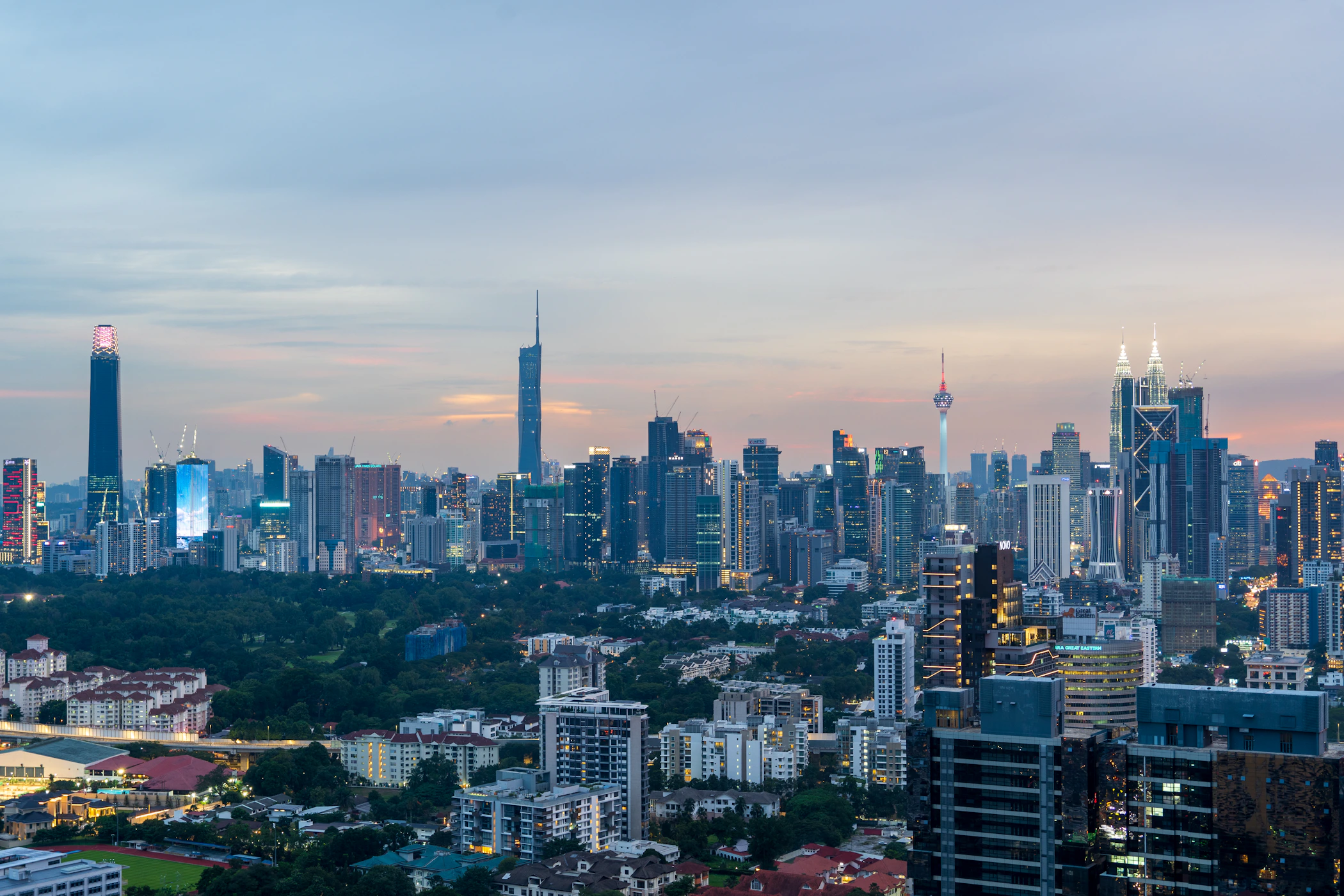 Kuala Lumpur skyline with the Petronas Towers and KL Tower at sunset, Malaysia