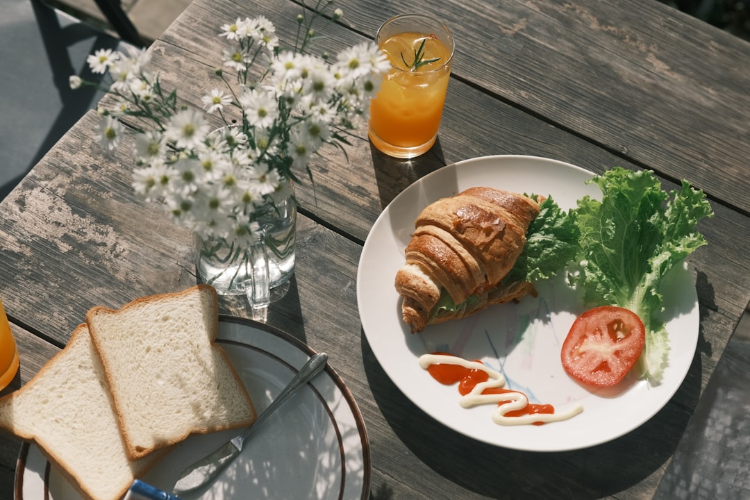 A plate of food on a wooden table,