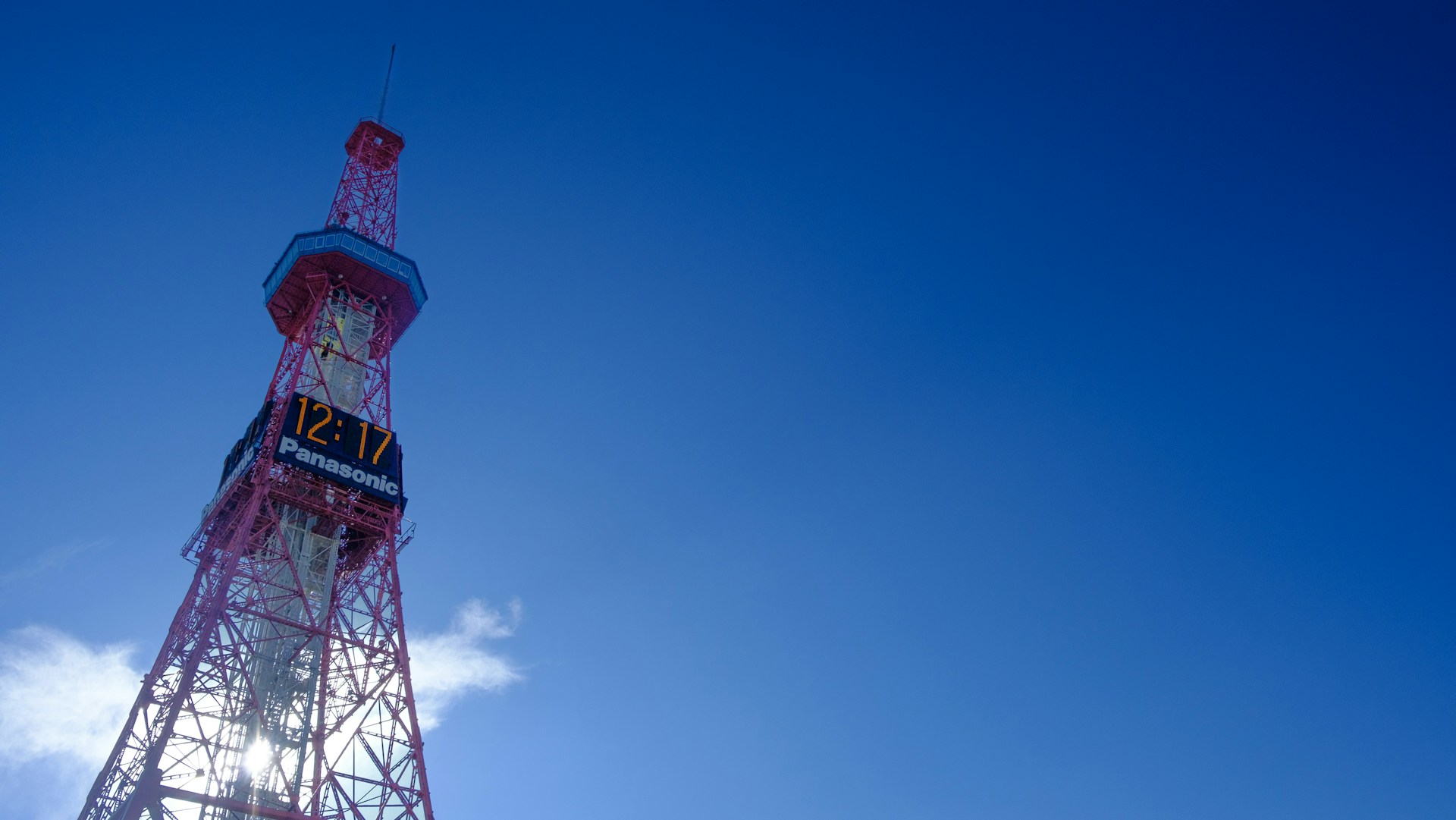 A very tall tower with a sky background