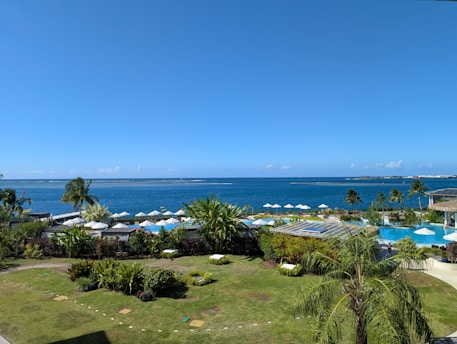 An aerial view of a resort with a swimming pool