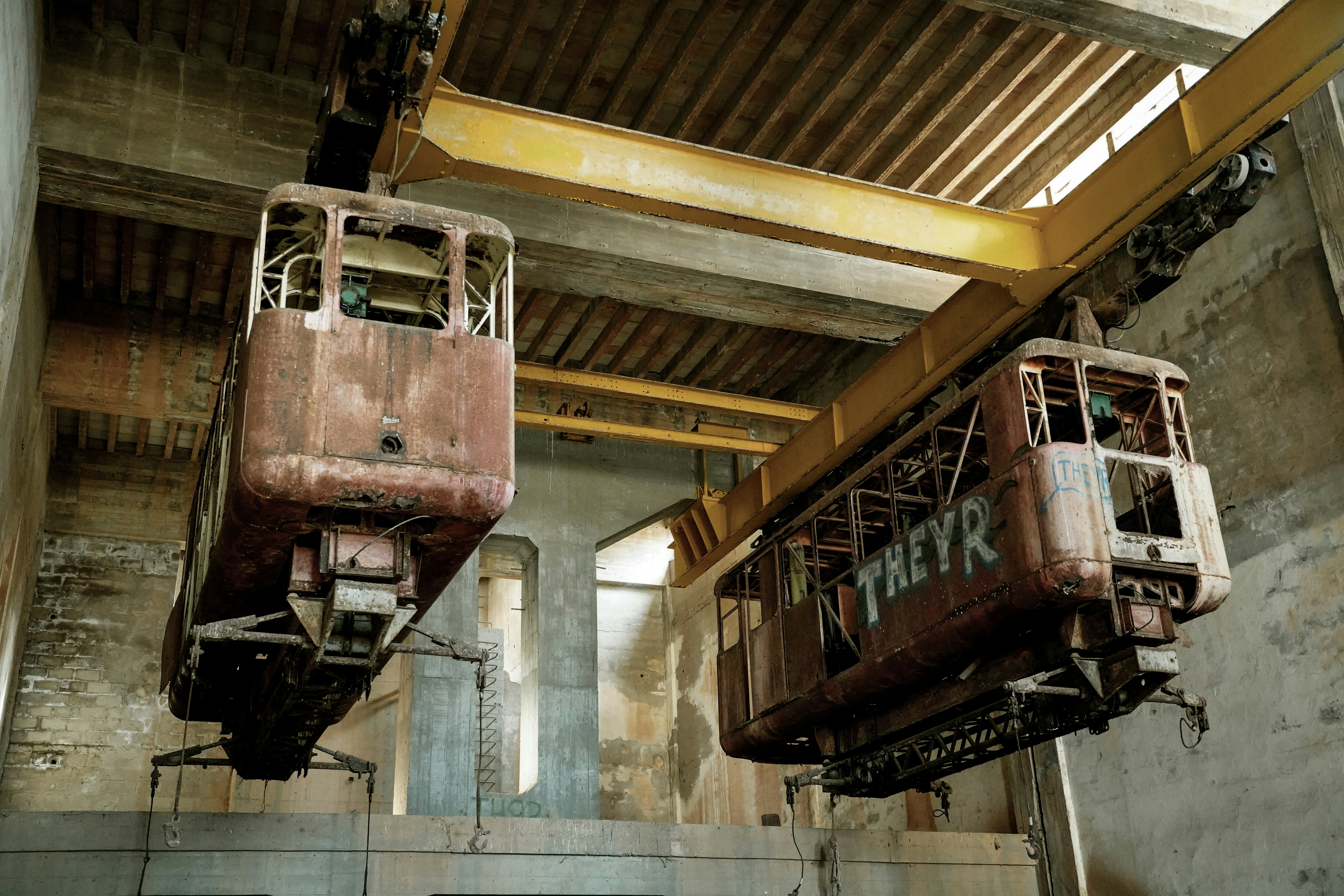 A couple of trains that are in a building