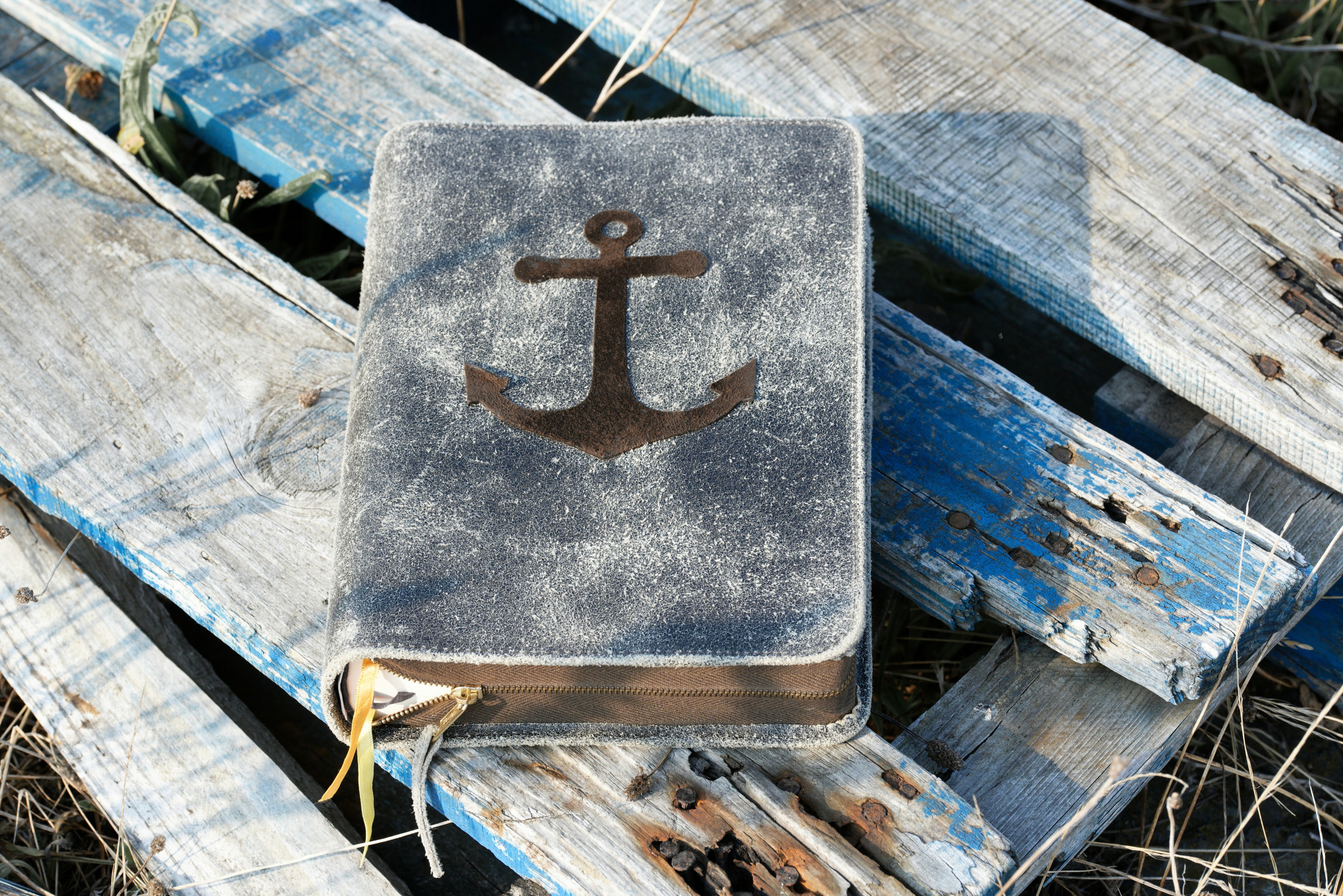 An old book with an anchor on it