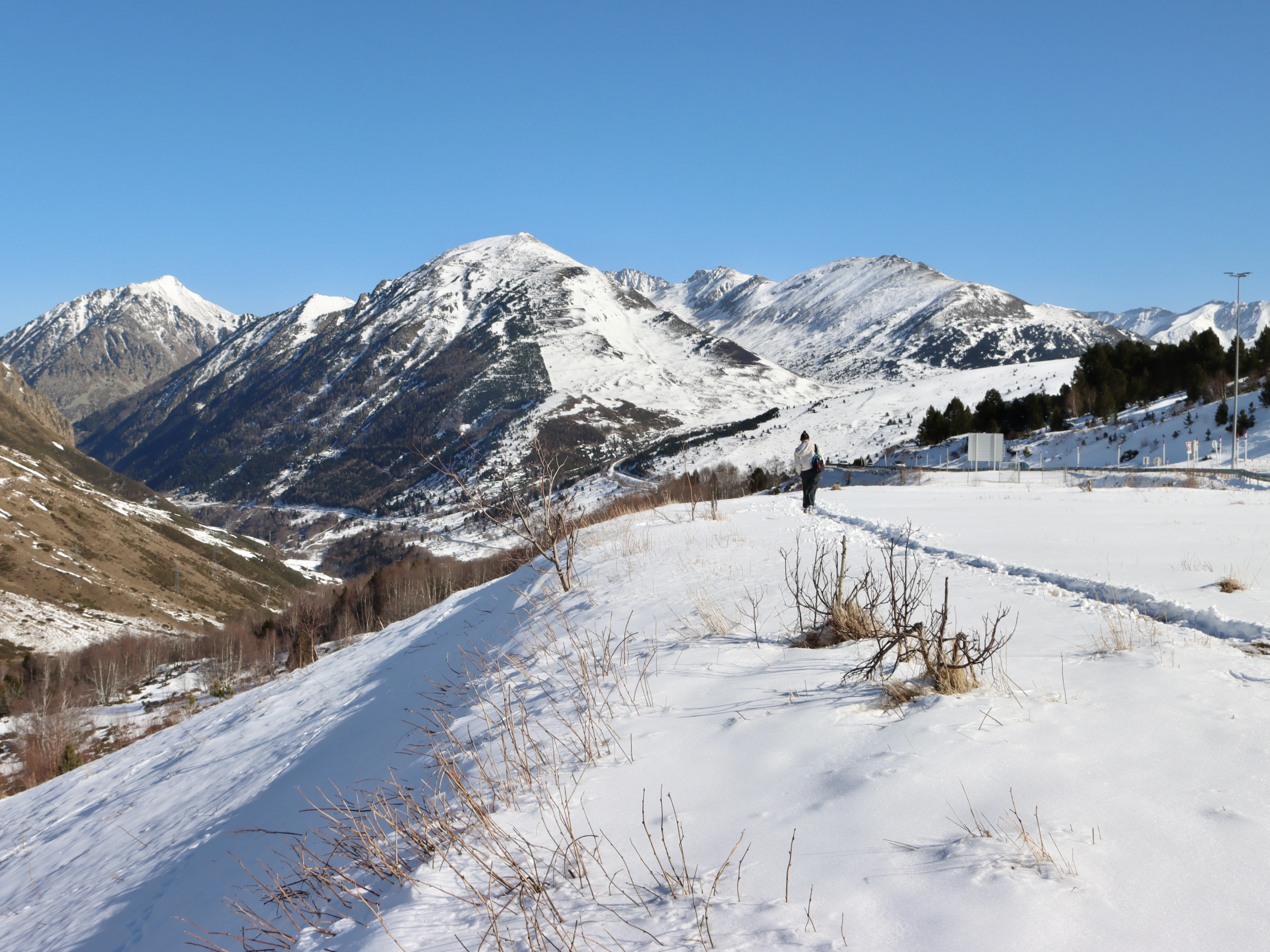 A snow-covered field below the mountains of Andorra, where skiing Arinsal means Pal too