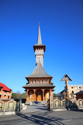 A tall building with a steeple on top of it