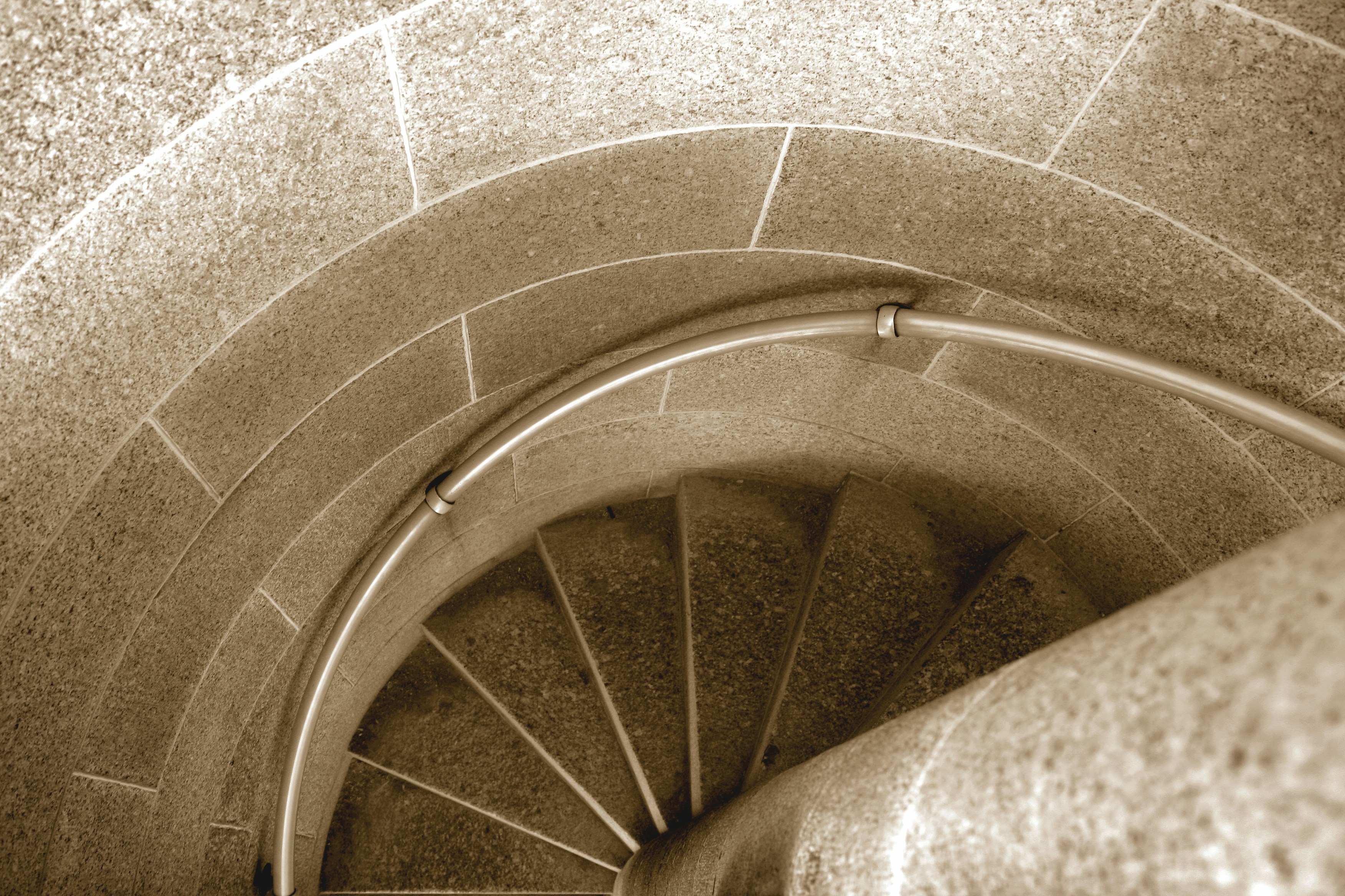 A close up of a spiral staircase in a building