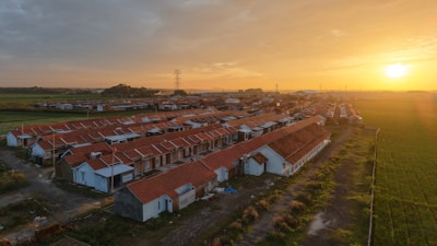An aerial view of a village at sunset