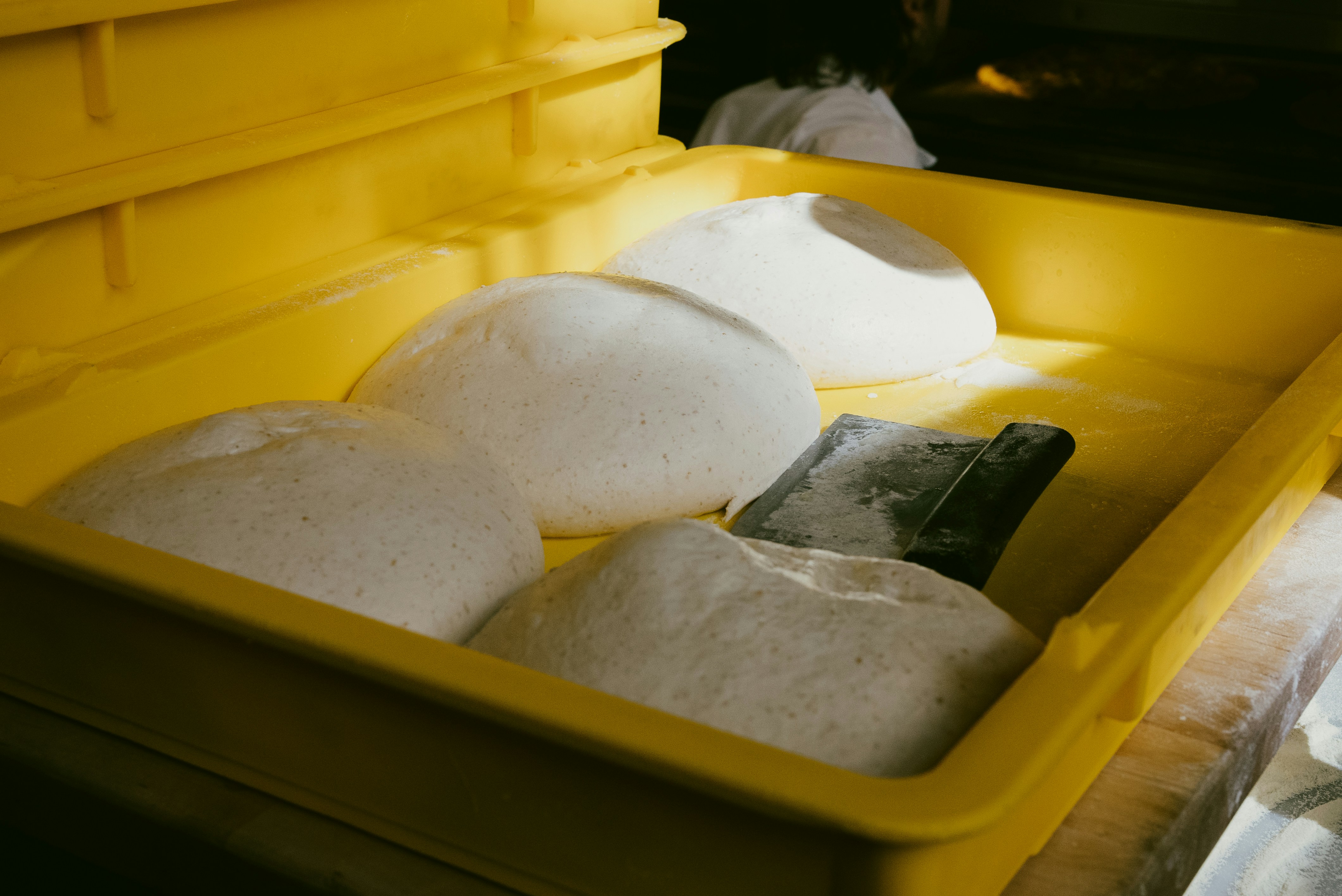 A yellow bin filled with lots of white stuff