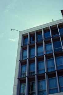 Modern building facade with many windows against sky