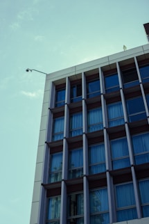 Modern building facade with many windows against sky