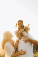 A man holding a little girl in his arms