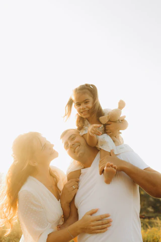 A man holding a little girl in his arms