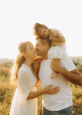A man holding a little girl in his arms