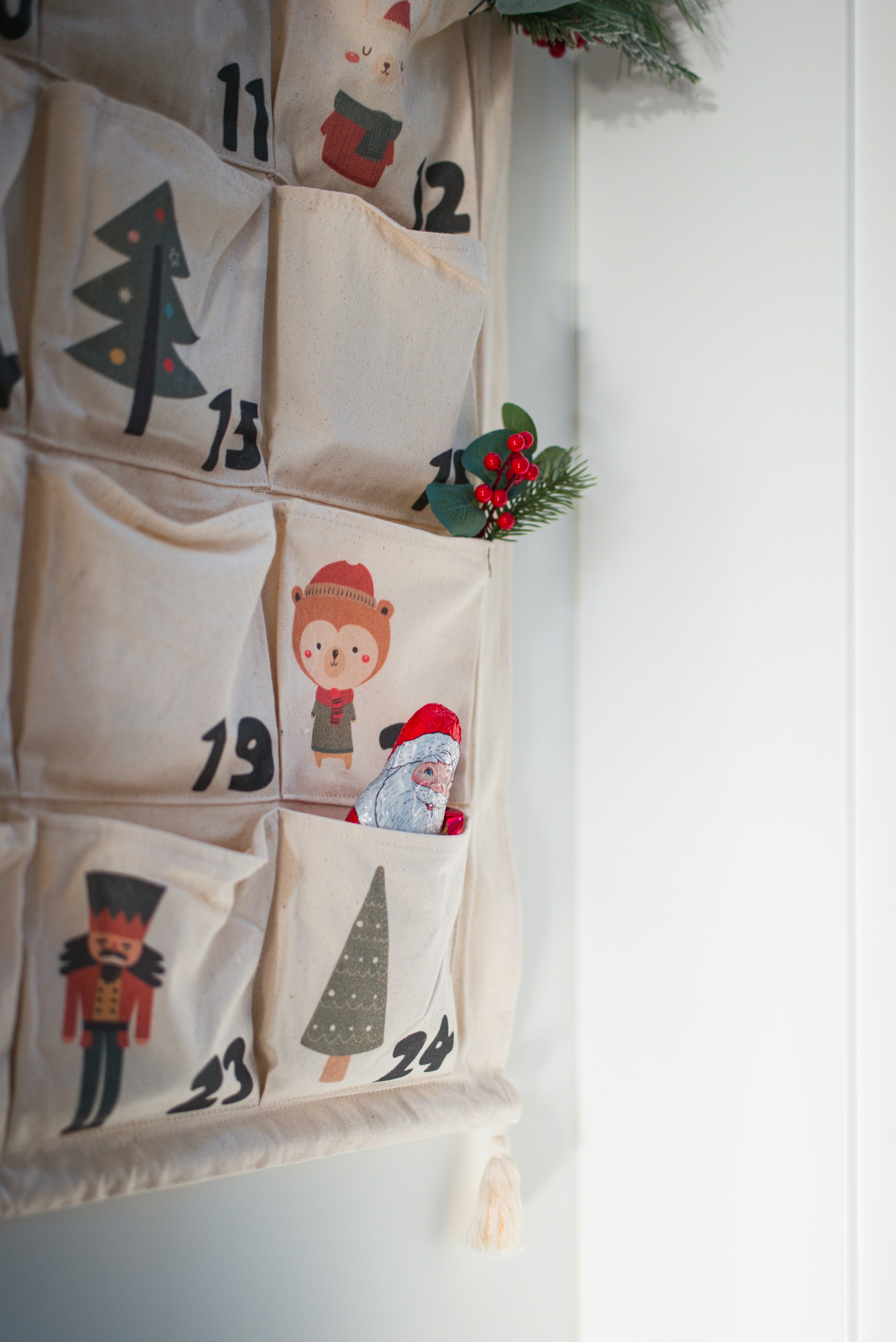A christmas themed wall hanging on a wall
