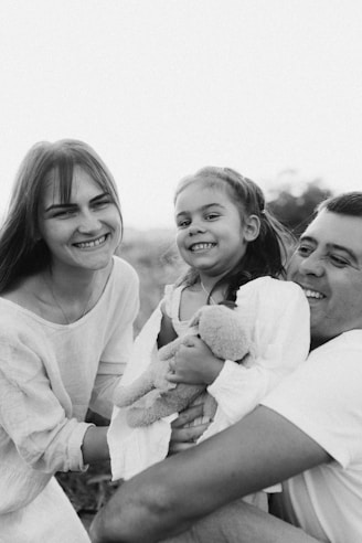 A group of people sitting next to each other