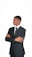 A man in a suit with his arms crossed