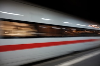 A blurry photo of a train speeding by