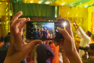 A person taking a picture with a cell phone