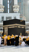 A group of people standing around a large black box