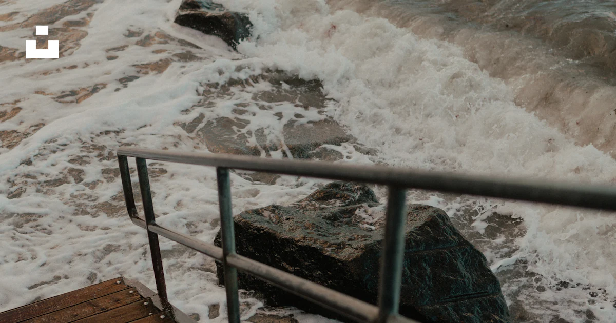 Unsplash Ramps A person walking up a wooden ramp to the ocean photo – Free Waterfront ...