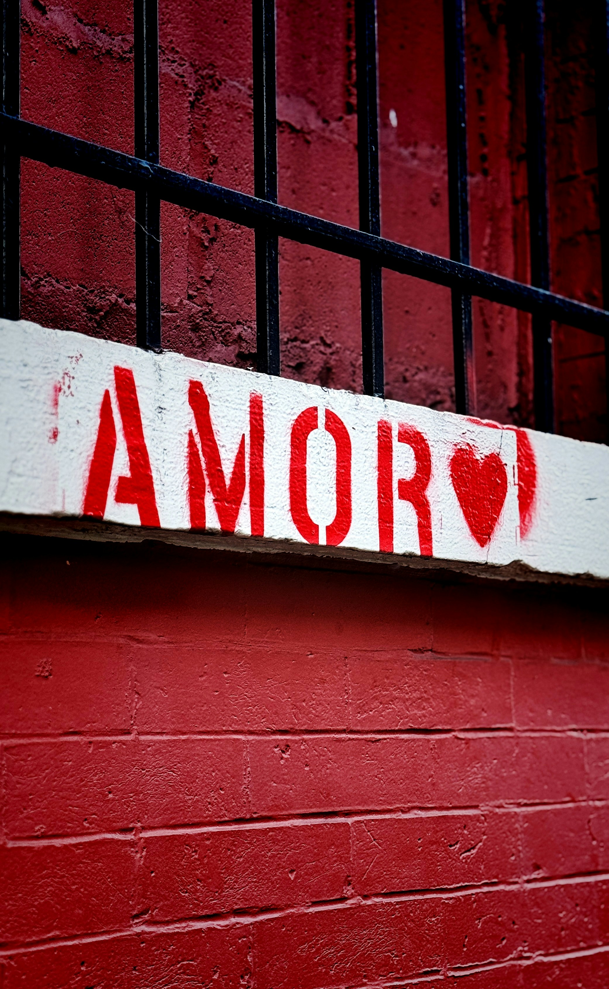 A red door with a sign that says i love amaro