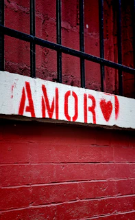 A red door with a sign that says i love amaro