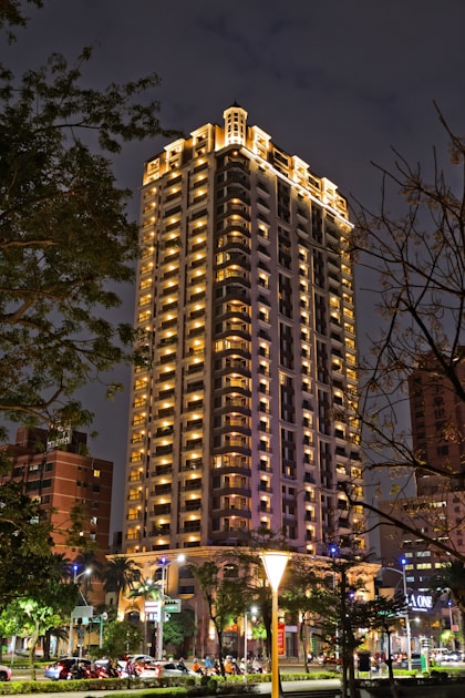 A very tall building lit up at night