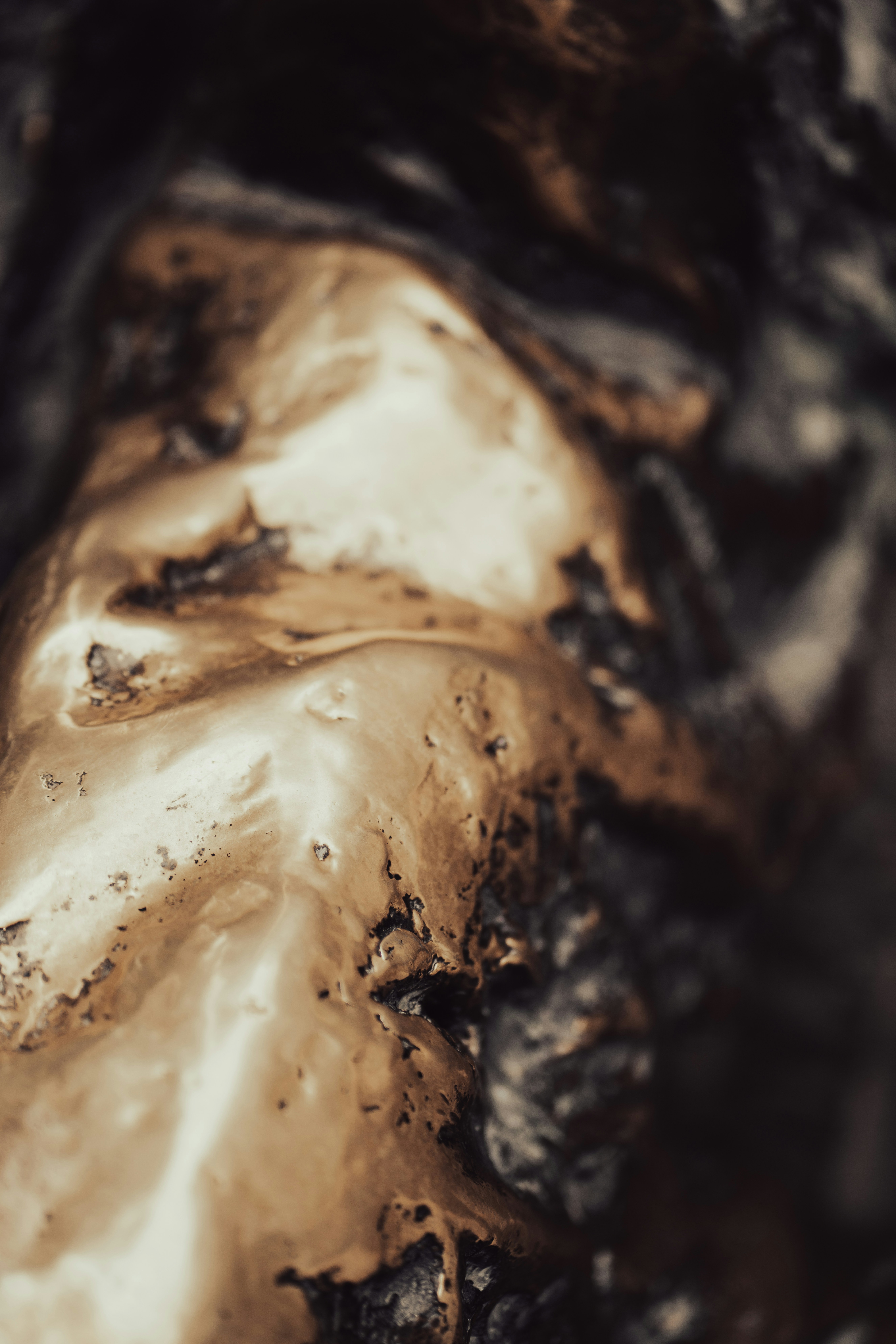 A close up of a brown substance on a black surface