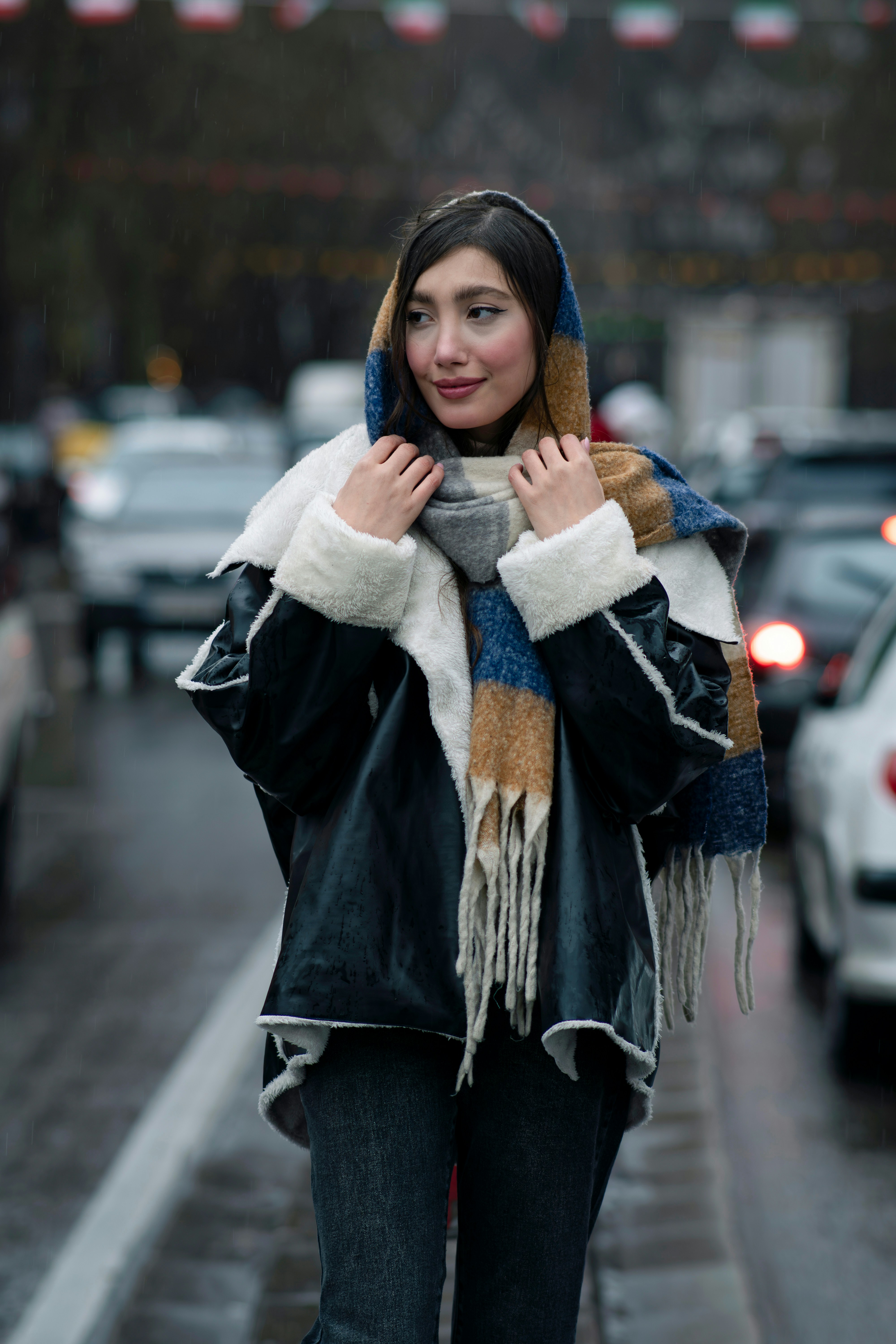 How to Style Scarves for Every Season: Effortless Looks You’ll Love – A woman walking down the street in the rain