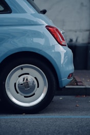 A blue car parked on the side of the road