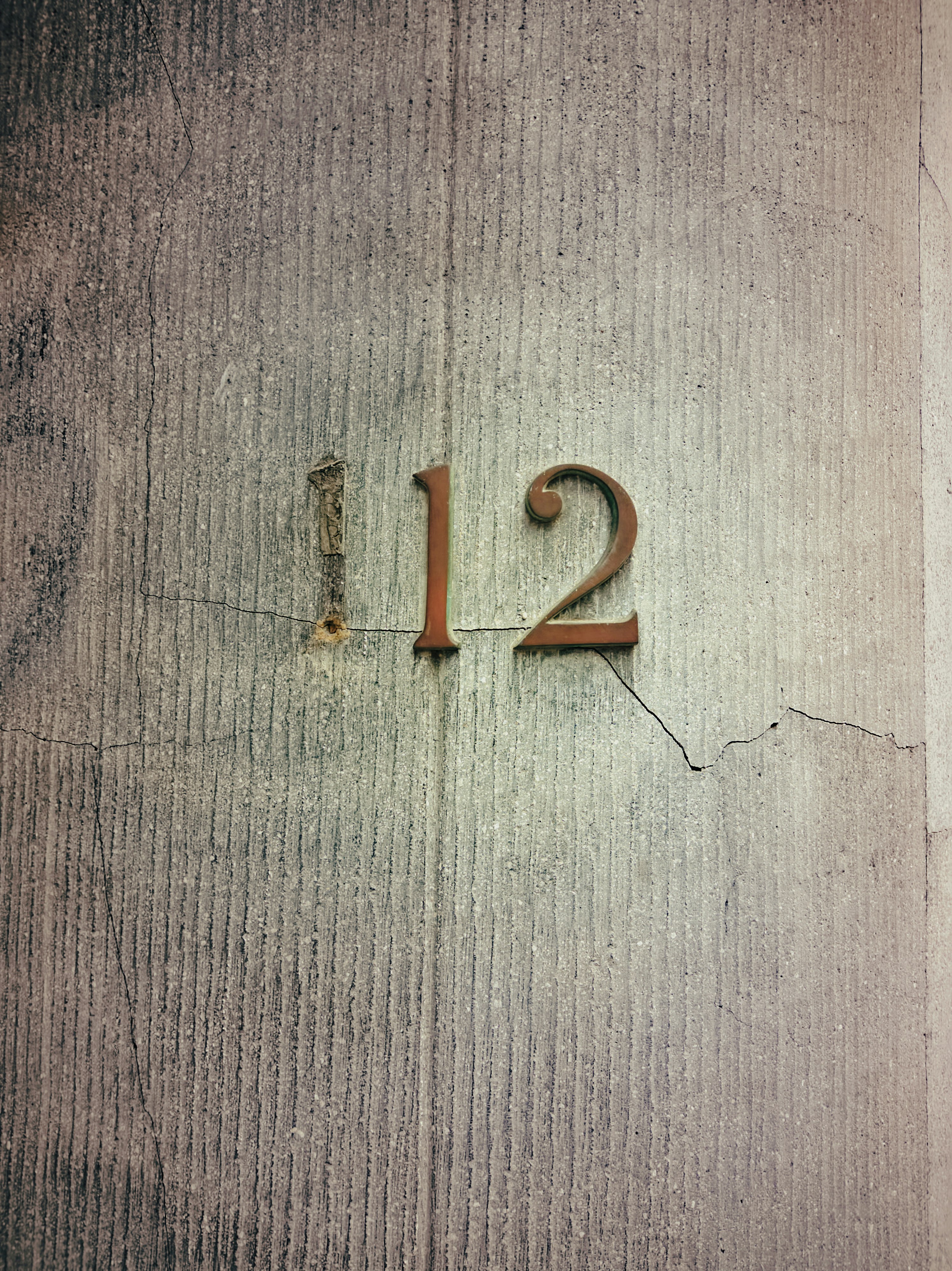 A close up of a number on a wall