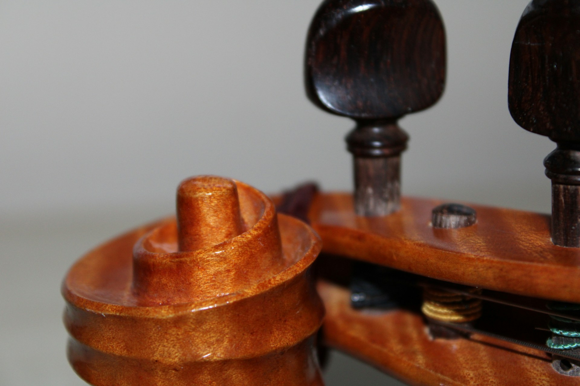 A close up of a wooden object on a table