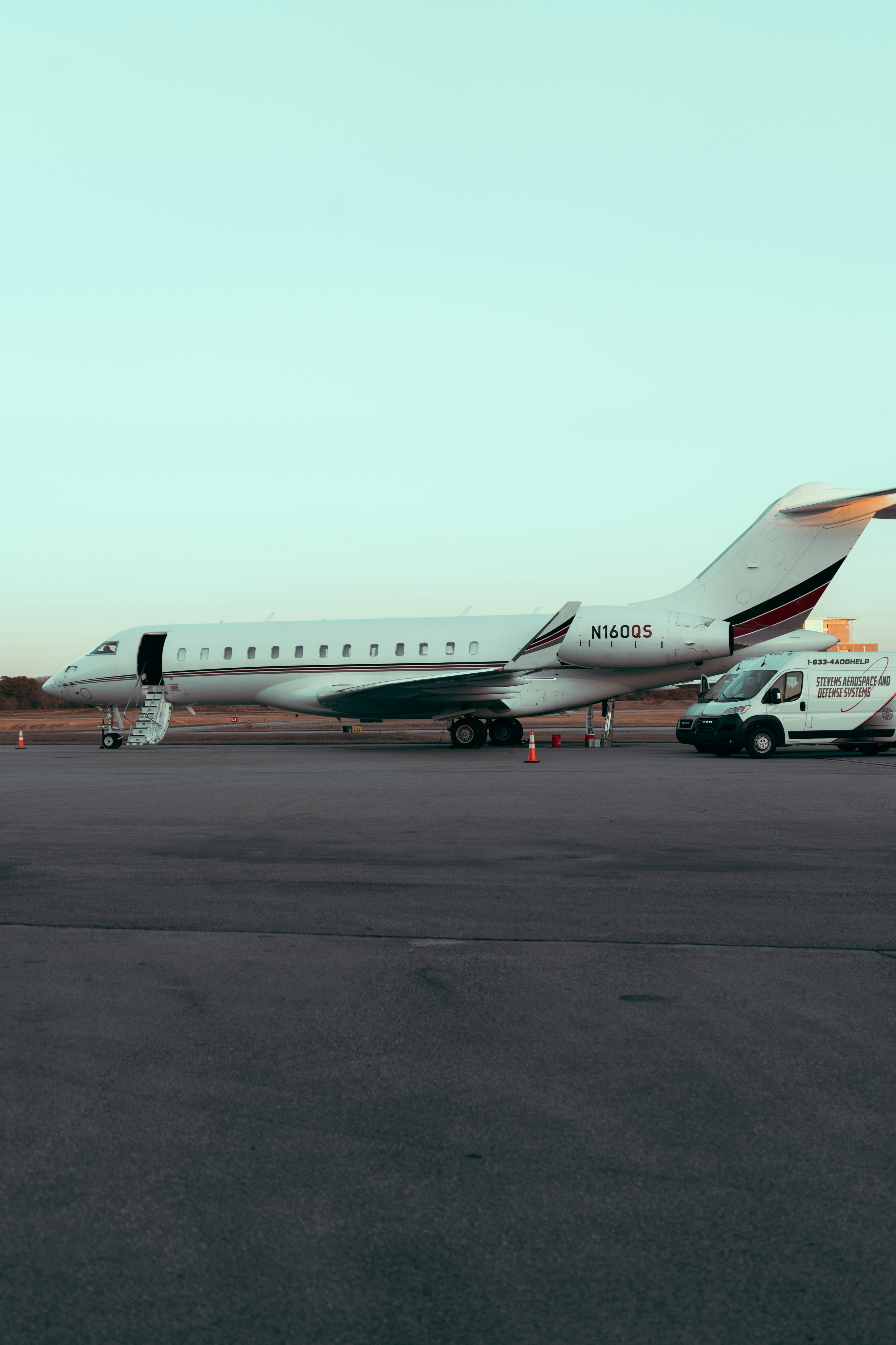 A large jetliner sitting on top of an airport tarmac