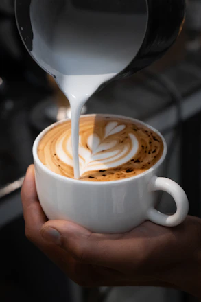 A cup of coffee being poured into it