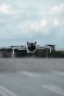 A small airplane is taking off from an airport runway