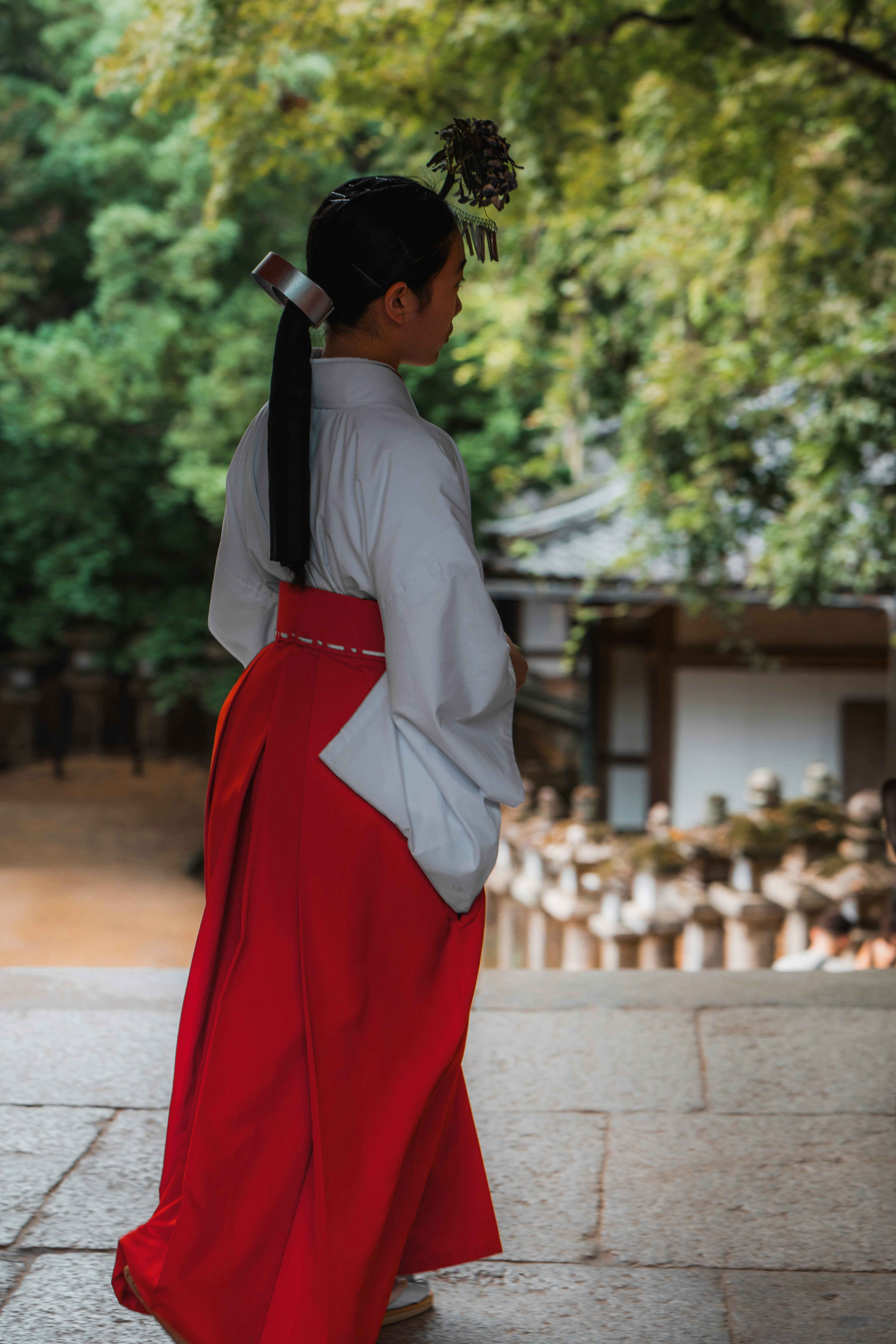A woman in a red and white kimono