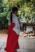 A woman in a red and white kimono